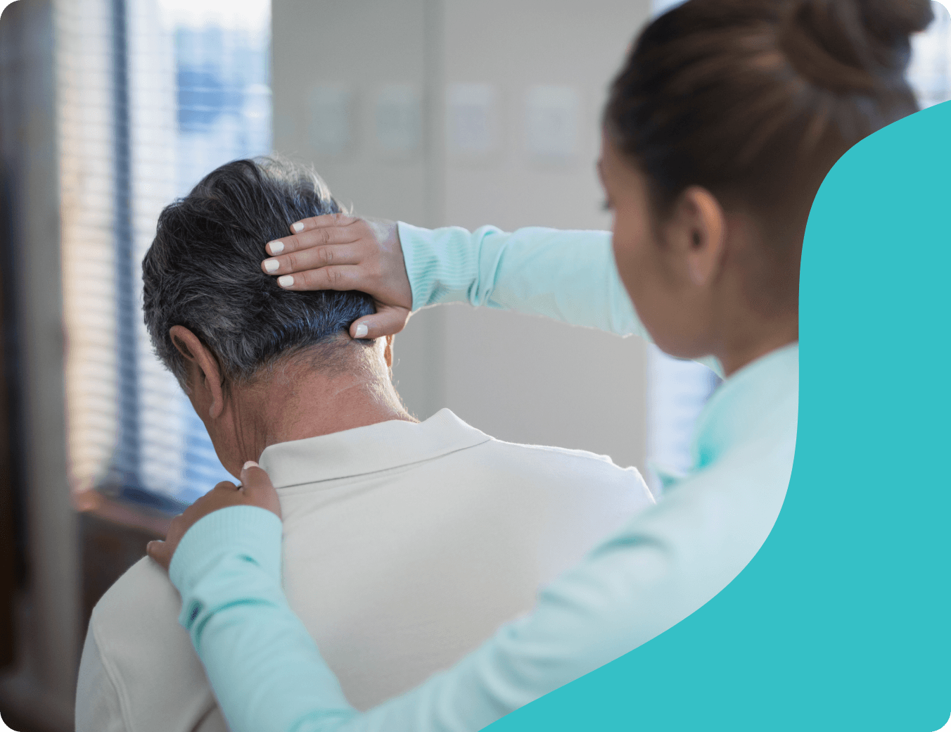 Caregiver providing shoulder support to an older adult